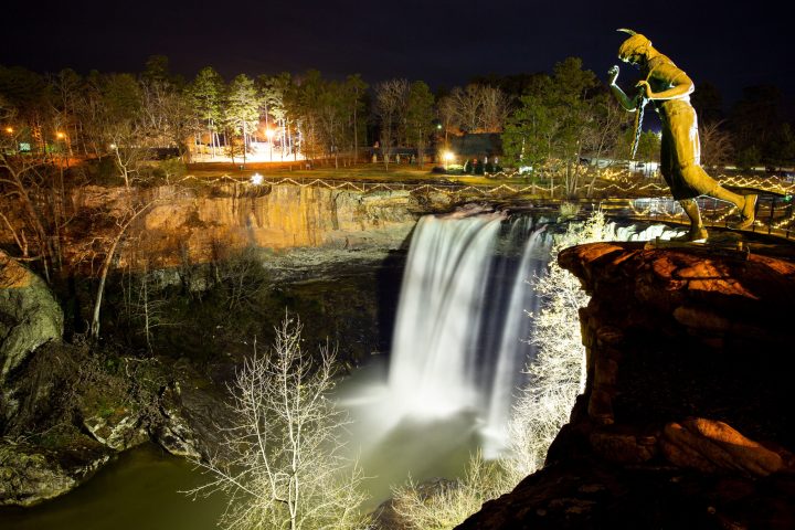 a man riding on the back of a waterfall