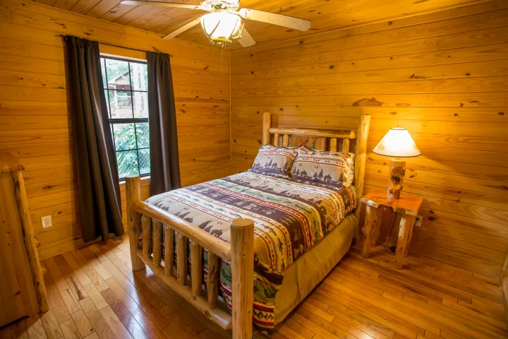 a bedroom with a bed in a room