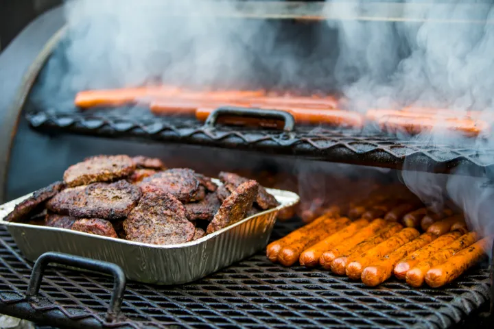 a bunch of food sitting on a grill