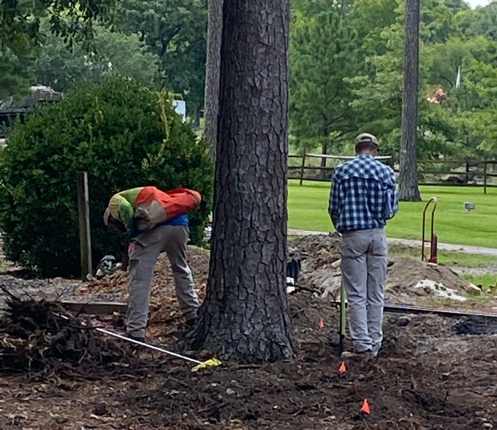Surveyors plotting the center line of the new train tracks
