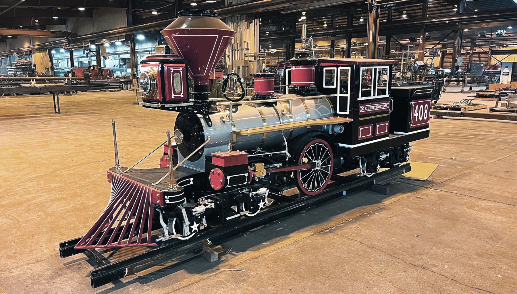 a train that is sitting on a cart